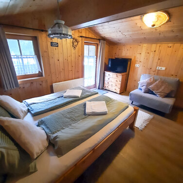 Schlafzimmer Ferienhaus Breitner Chalet Wasserfallblick